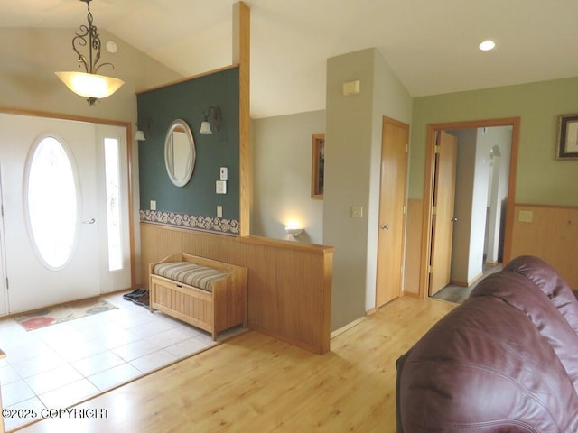 2340 E End Rd, Homer, AK 99603 - entrance foyer featuring lofted ceiling, light wood-style flooring, and wainscoting