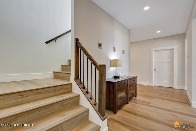 8236 Byron Dr, Anchorage, AK 99516 - stairs featuring wood finished floors, baseboards, and recessed lighting