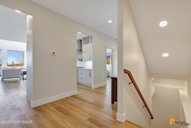8236 Byron Dr, Anchorage, AK 99516 - hall featuring an upstairs landing, light wood-style floors, baseboards, and recessed lighting
