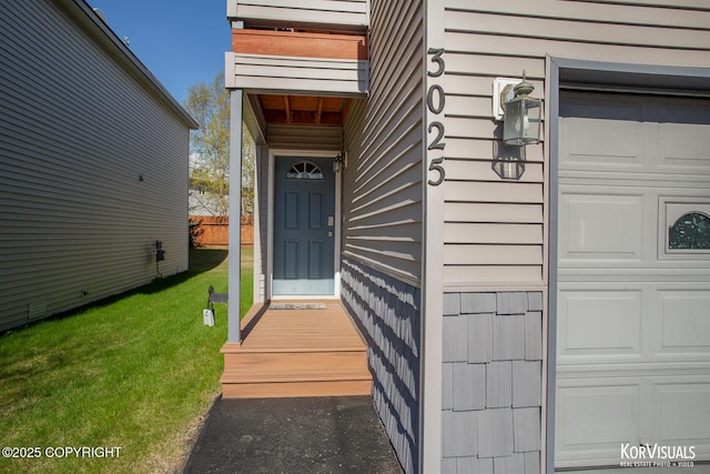 3025 Seclusion Cove Dr # 43, Anchorage, AK 99515 - property entrance with a garage and a yard