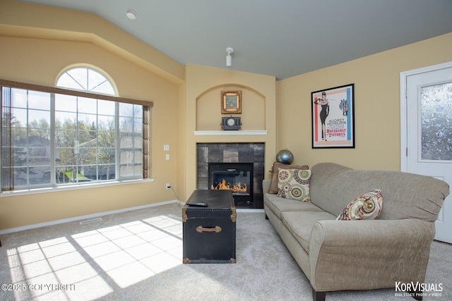 3025 Seclusion Cove Dr # 43, Anchorage, AK 99515 - living room with carpet floors, a fireplace, vaulted ceiling, and baseboards