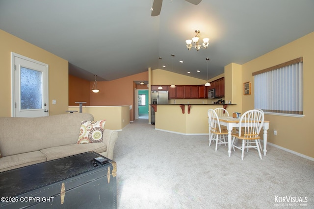 3025 Seclusion Cove Dr # 43, Anchorage, AK 99515 - living area with lofted ceiling, ceiling fan, a chandelier, light colored carpet, and baseboards