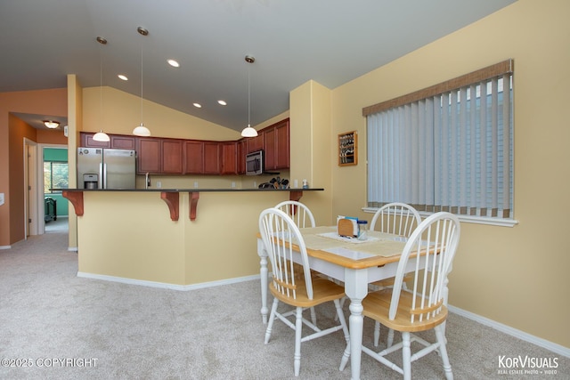 3025 Seclusion Cove Dr # 43, Anchorage, AK 99515 - dining area with lofted ceiling, light colored carpet, recessed lighting, and baseboards