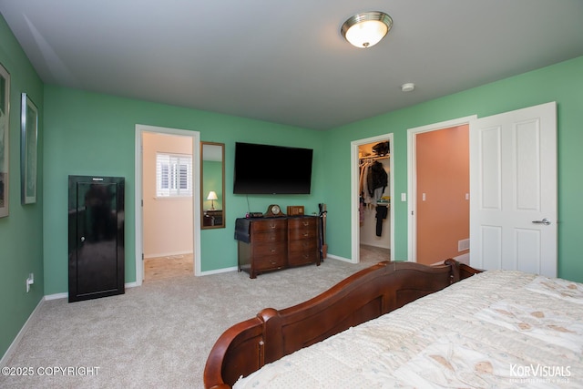 3025 Seclusion Cove Dr # 43, Anchorage, AK 99515 - carpeted bedroom featuring a spacious closet, baseboards, and a closet