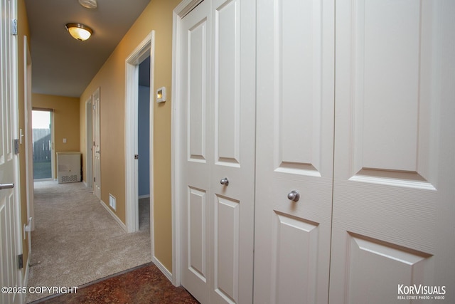 3025 Seclusion Cove Dr # 43, Anchorage, AK 99515 - corridor featuring dark carpet and baseboards