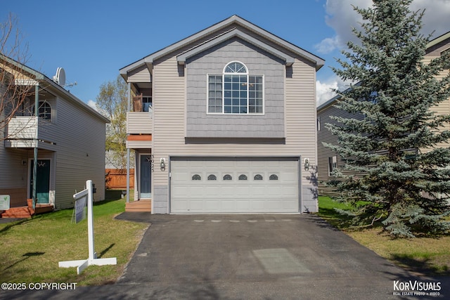 3025 Seclusion Cove Dr # 43, Anchorage, AK 99515 - traditional home with an attached garage, asphalt driveway, and a front lawn