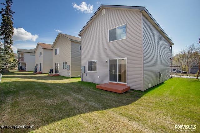 3025 Seclusion Cove Dr # 43, Anchorage, AK 99515 - rear view of house featuring a yard and a wooden deck
