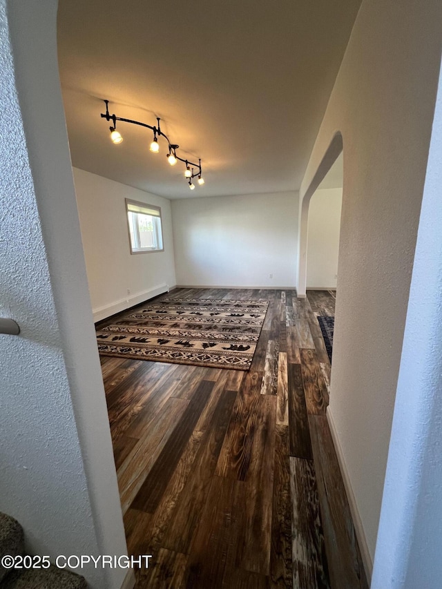 981 E Susitna Dr, Wasilla, AK 99654 - unfurnished dining area with arched walkways and wood finished floors