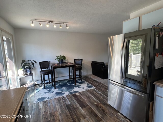 981 E Susitna Dr, Wasilla, AK 99654 - dining space with dark wood-type flooring and a textured ceiling