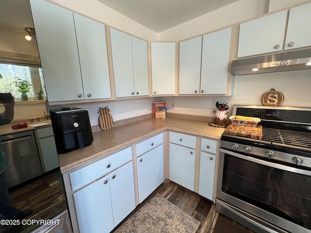 981 E Susitna Dr, Wasilla, AK 99654 - kitchen featuring gas stove, under cabinet range hood, dark wood finished floors, light countertops, and white cabinetry