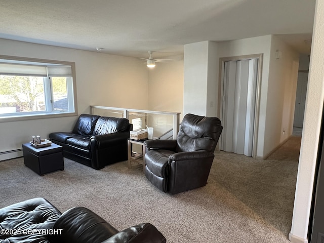 981 E Susitna Dr, Wasilla, AK 99654 - carpeted living room featuring a baseboard radiator and a ceiling fan