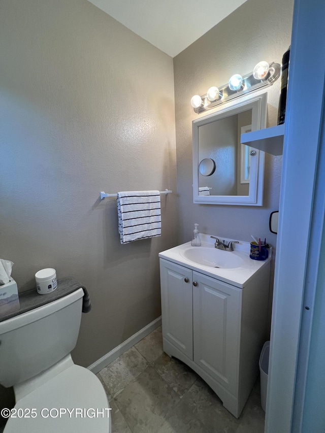 981 E Susitna Dr, Wasilla, AK 99654 - half bath with toilet, baseboards, and vanity