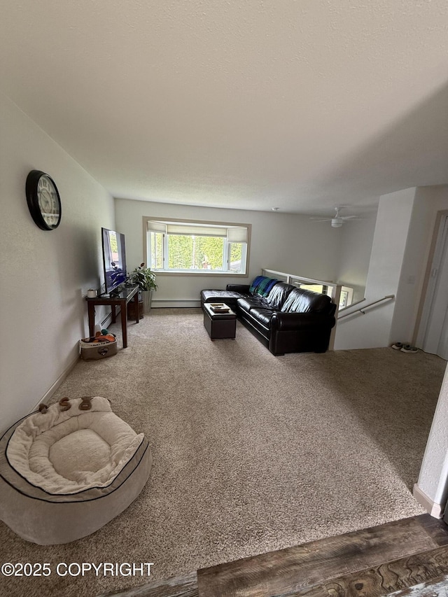 981 E Susitna Dr, Wasilla, AK 99654 - living area featuring carpet floors, a baseboard heating unit, and a ceiling fan