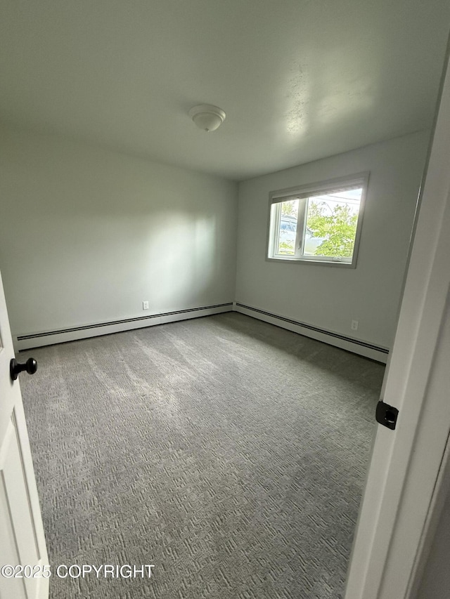981 E Susitna Dr, Wasilla, AK 99654 - empty room with carpet and a baseboard heating unit