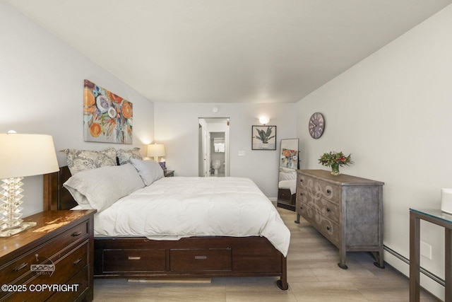 bedroom with a baseboard radiator