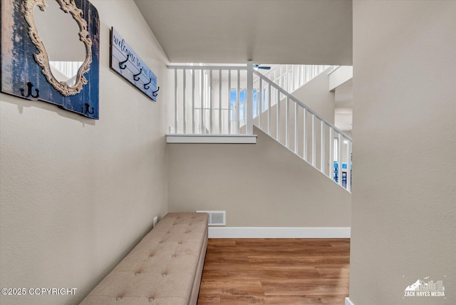 2945 Morgan Loop, Anchorage, AK 99516 - stairs featuring wood finished floors and baseboards
