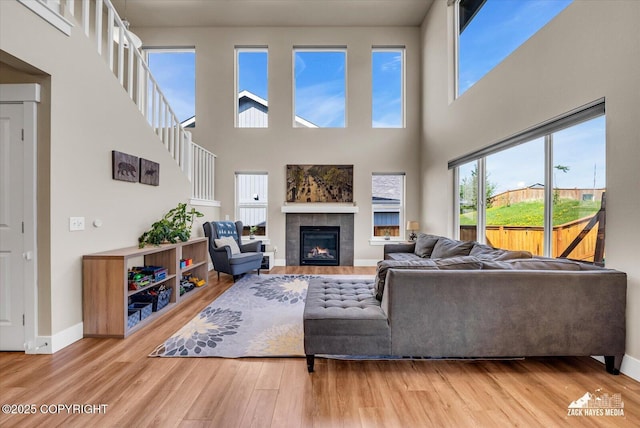 2945 Morgan Loop, Anchorage, AK 99516 - living room with wood finished floors, healthy amount of natural light, baseboards, and a high ceiling