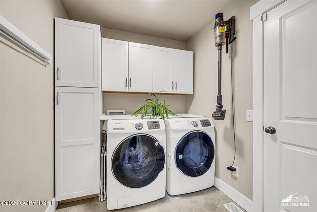 2945 Morgan Loop, Anchorage, AK 99516 - laundry room with cabinet space, washer and dryer, and baseboards