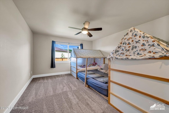 2945 Morgan Loop, Anchorage, AK 99516 - bedroom with baseboards, carpet floors, and a ceiling fan