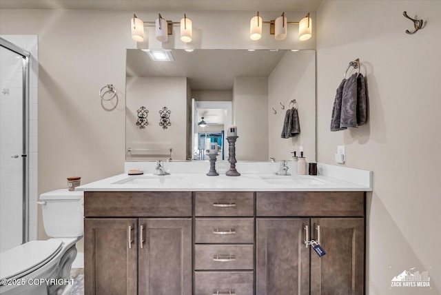 2945 Morgan Loop, Anchorage, AK 99516 - full bathroom featuring double vanity, toilet, and a tile shower