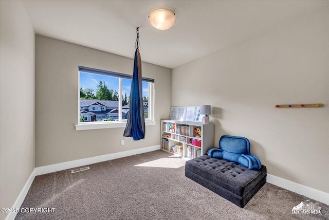 2945 Morgan Loop, Anchorage, AK 99516 - sitting room with carpet flooring and baseboards