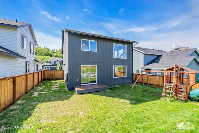 2945 Morgan Loop, Anchorage, AK 99516 - back of property with a playground and a deck