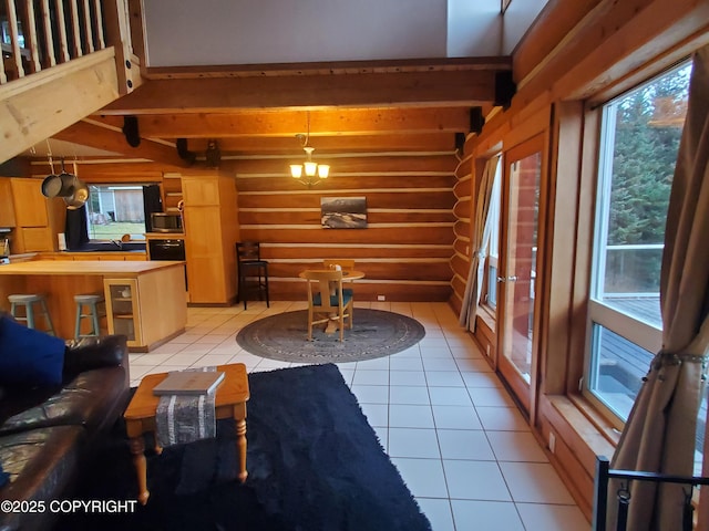 4510 Thomas Ct, Homer, AK 99603 - living area featuring rustic walls, beamed ceiling, and light tile patterned floors