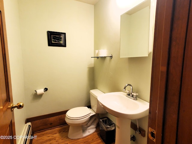 4510 Thomas Ct, Homer, AK 99603 - half bath featuring baseboard heating, wood finished floors, and toilet