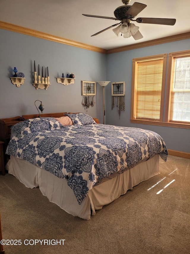 bedroom with carpet flooring, ornamental molding, a ceiling fan, and baseboards