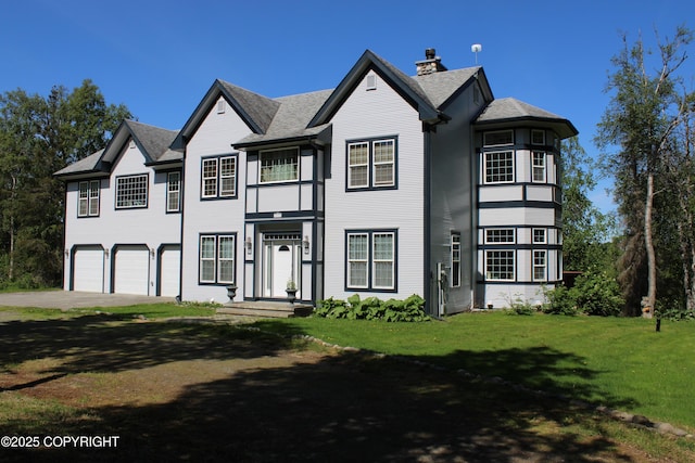 view of front of property with an attached garage, a front yard, concrete driveway, a chimney, and roof with shingles
