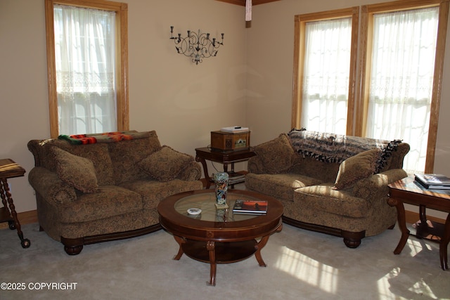 carpeted living room with plenty of natural light