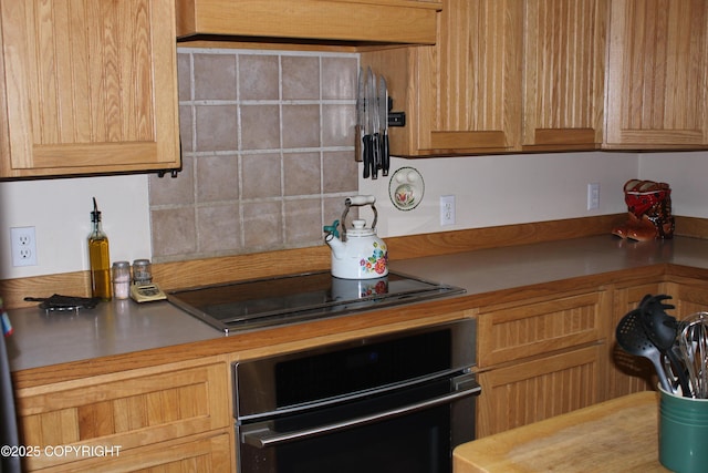 kitchen featuring black appliances and light countertops