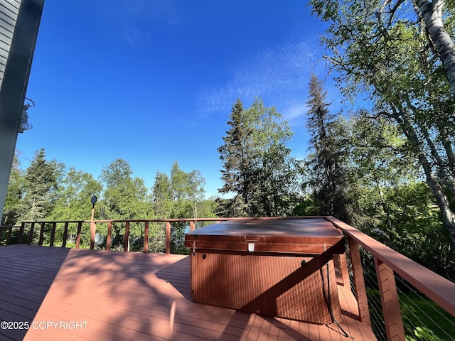 deck featuring a hot tub