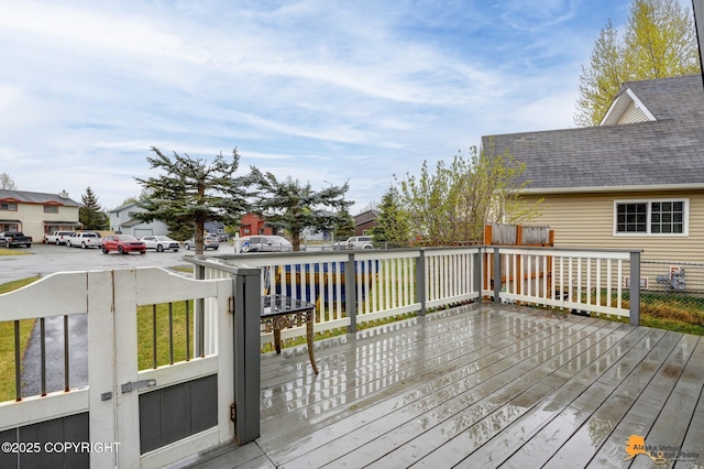 wooden terrace with a residential view