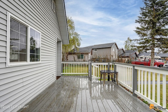 wooden terrace with a residential view