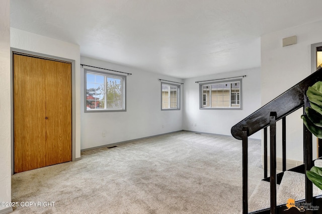 entryway with carpet flooring