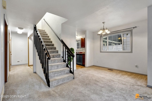 stairway featuring carpet flooring, a chandelier, and baseboards