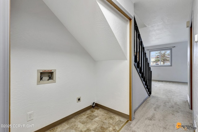 laundry room with hookup for a washing machine, baseboards, and electric dryer hookup