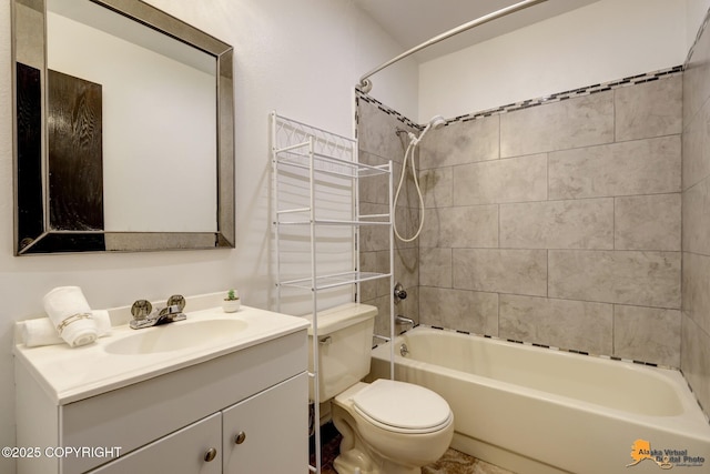bathroom with toilet, vanity, and shower / tub combination