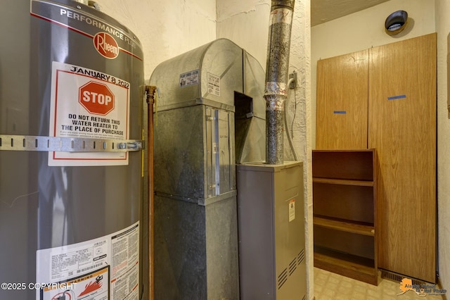 utility room featuring gas water heater