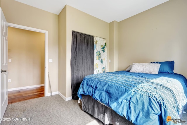 bedroom with carpet and baseboards