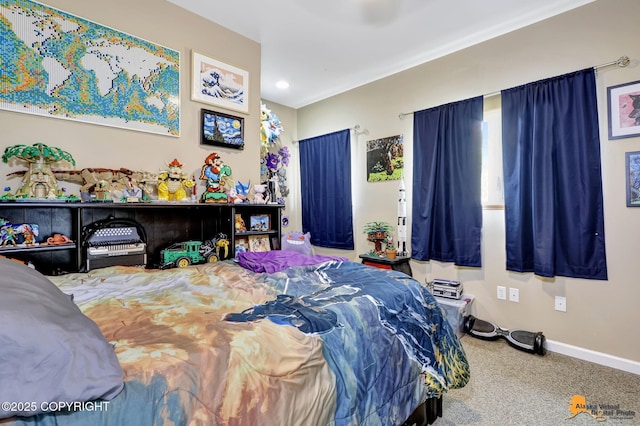 carpeted bedroom featuring baseboards and recessed lighting