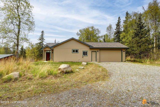 view of front of house featuring driveway and a garage