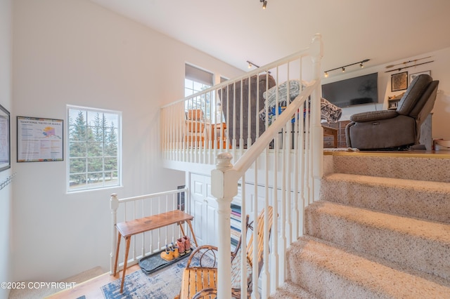 stairway featuring healthy amount of natural light