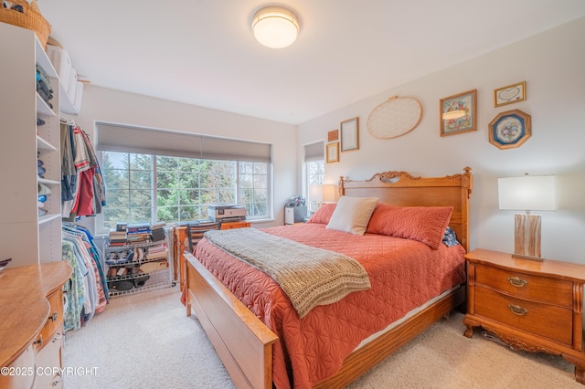 bedroom featuring light colored carpet