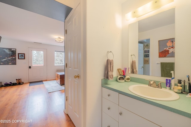 bathroom featuring wood finished floors and vanity