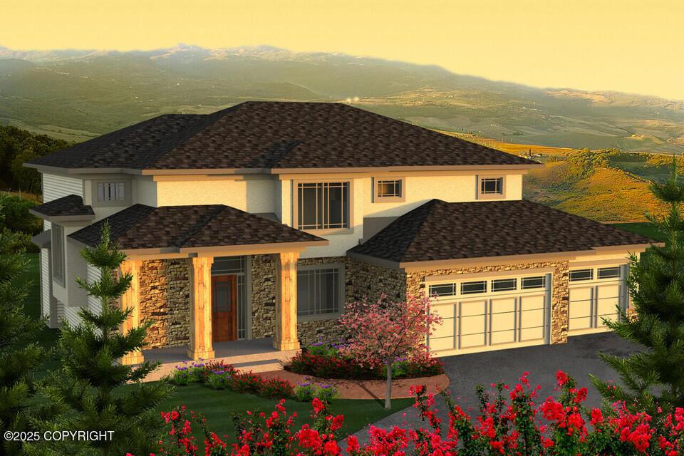 view of front of home featuring stone siding, stucco siding, a garage, asphalt driveway, and a mountain view