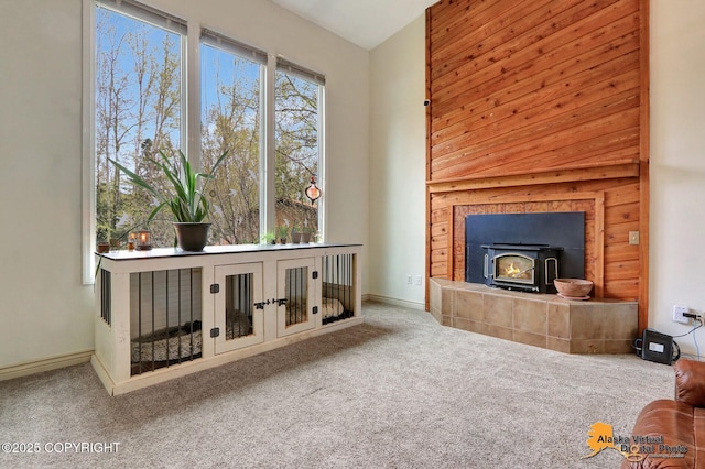 unfurnished living room with carpet flooring and baseboards
