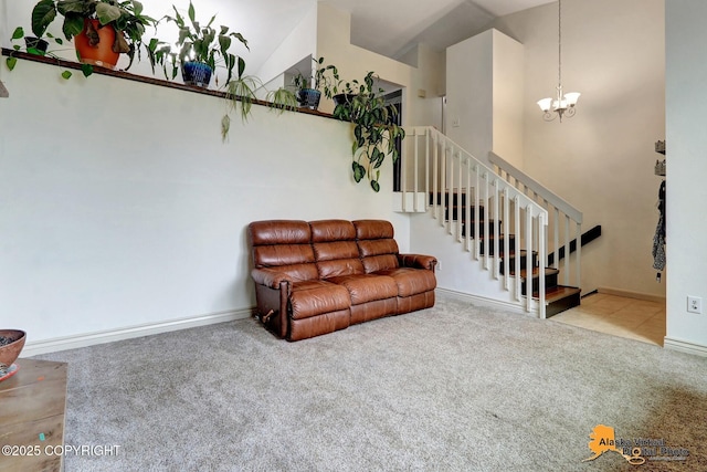 living room with carpet floors, a chandelier, stairway, and baseboards