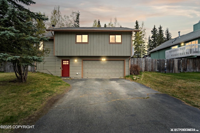 view of front of home with driveway and a garage